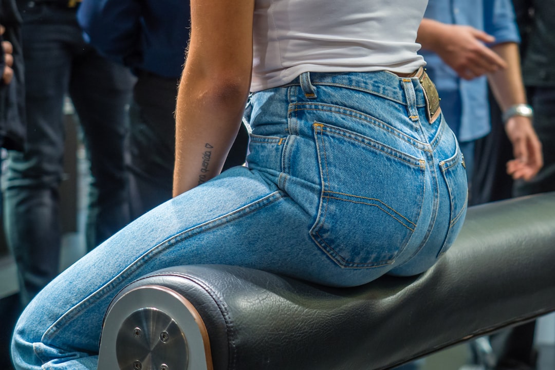 Judy Blue Flare Jeans: Bell Bottom or Standard Flare? - woman sitting on black leather surface close-up photographyt
