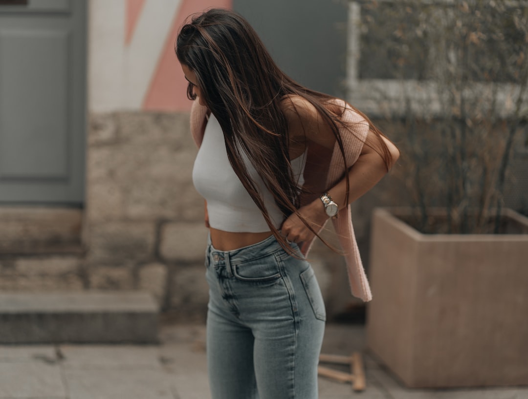 Is Kancan Skinny Jeans Worth It? Honest Review After Six Months - a woman leaning against a wall