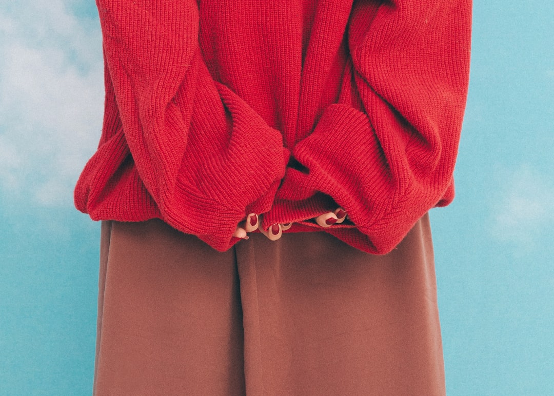 Is Kancan Wide Leg Jeans Worth It? Real Fit and Styling Review - A woman wearing a red sweater and brown pants